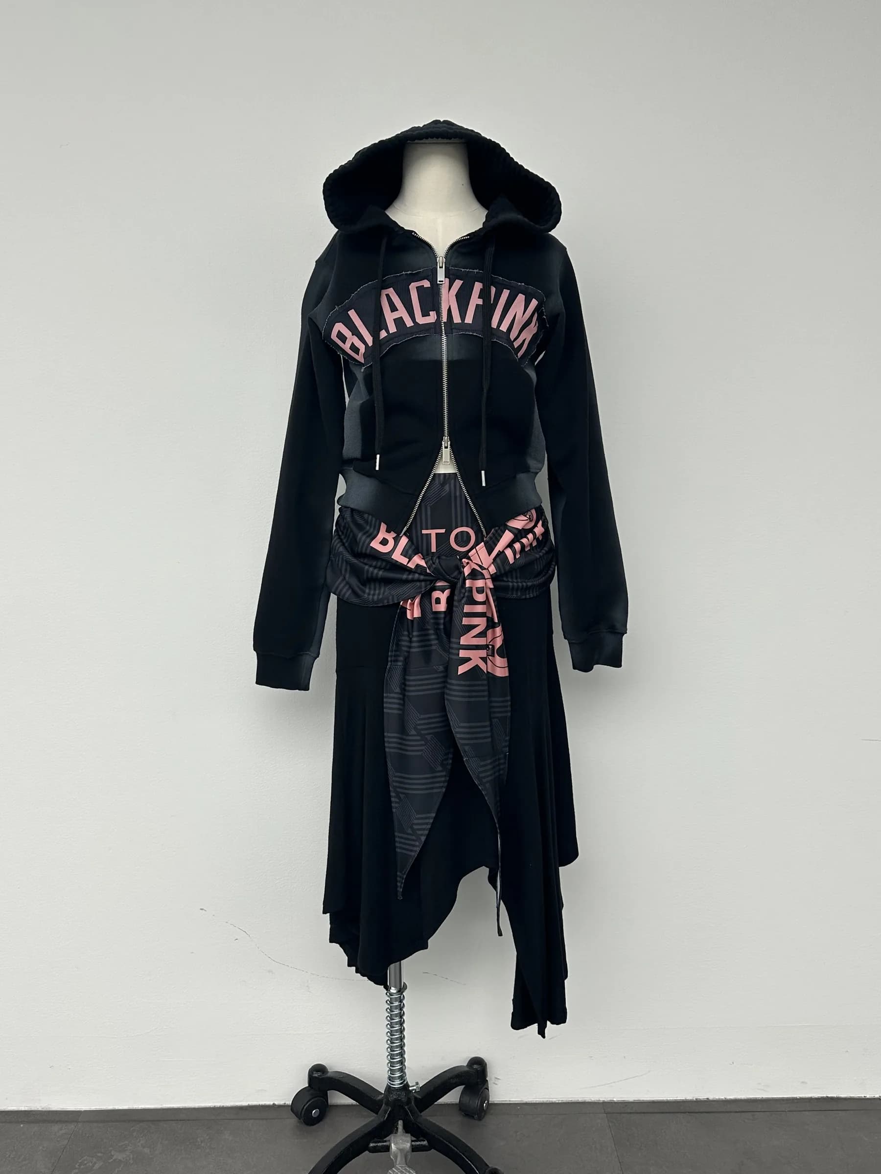 Hooded asymmetric dress on the form