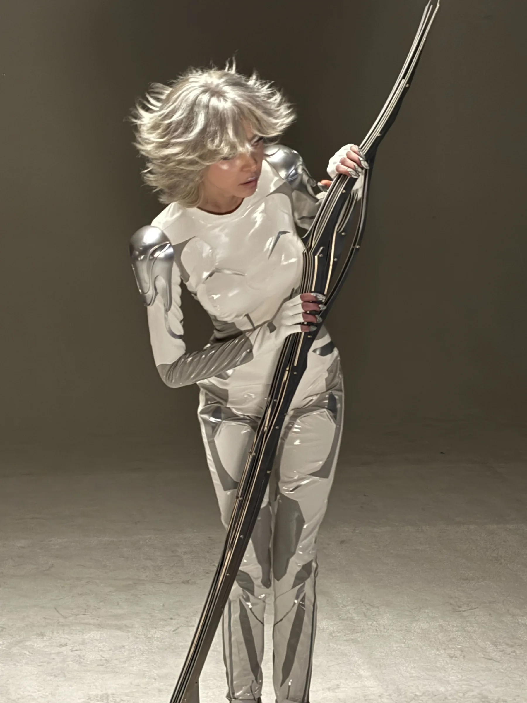 Custom liquid-silver bodysuit — on set