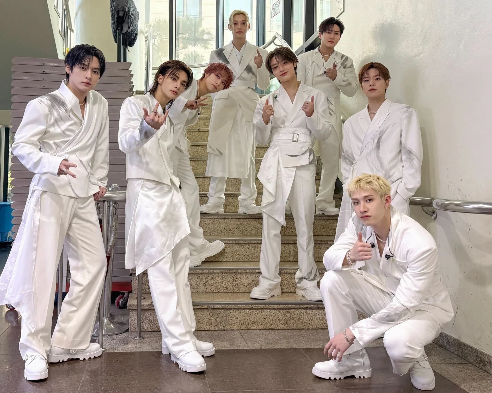Stray Kids in custom white tailoring