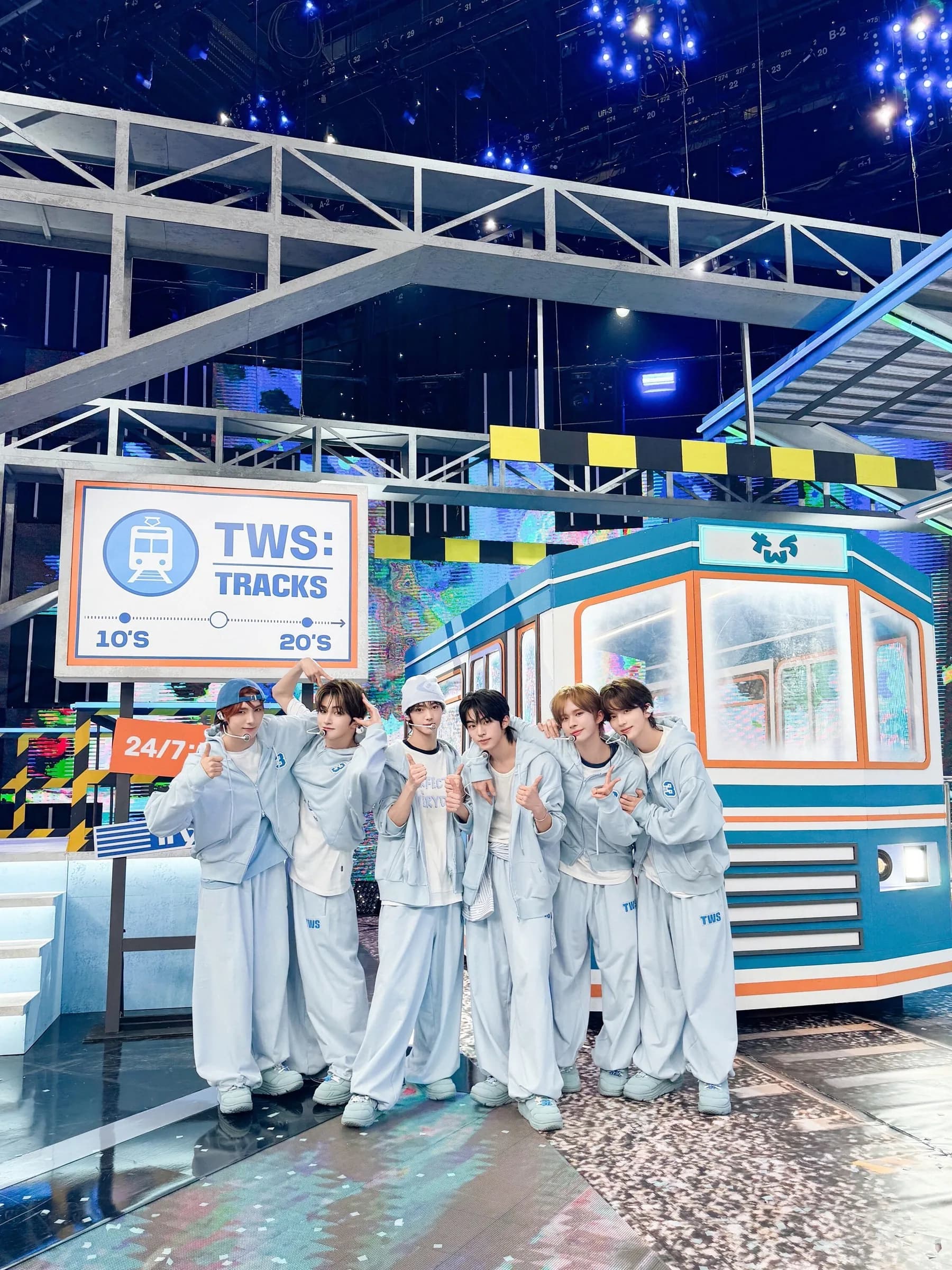 TWS in custom pale-blue stage sets