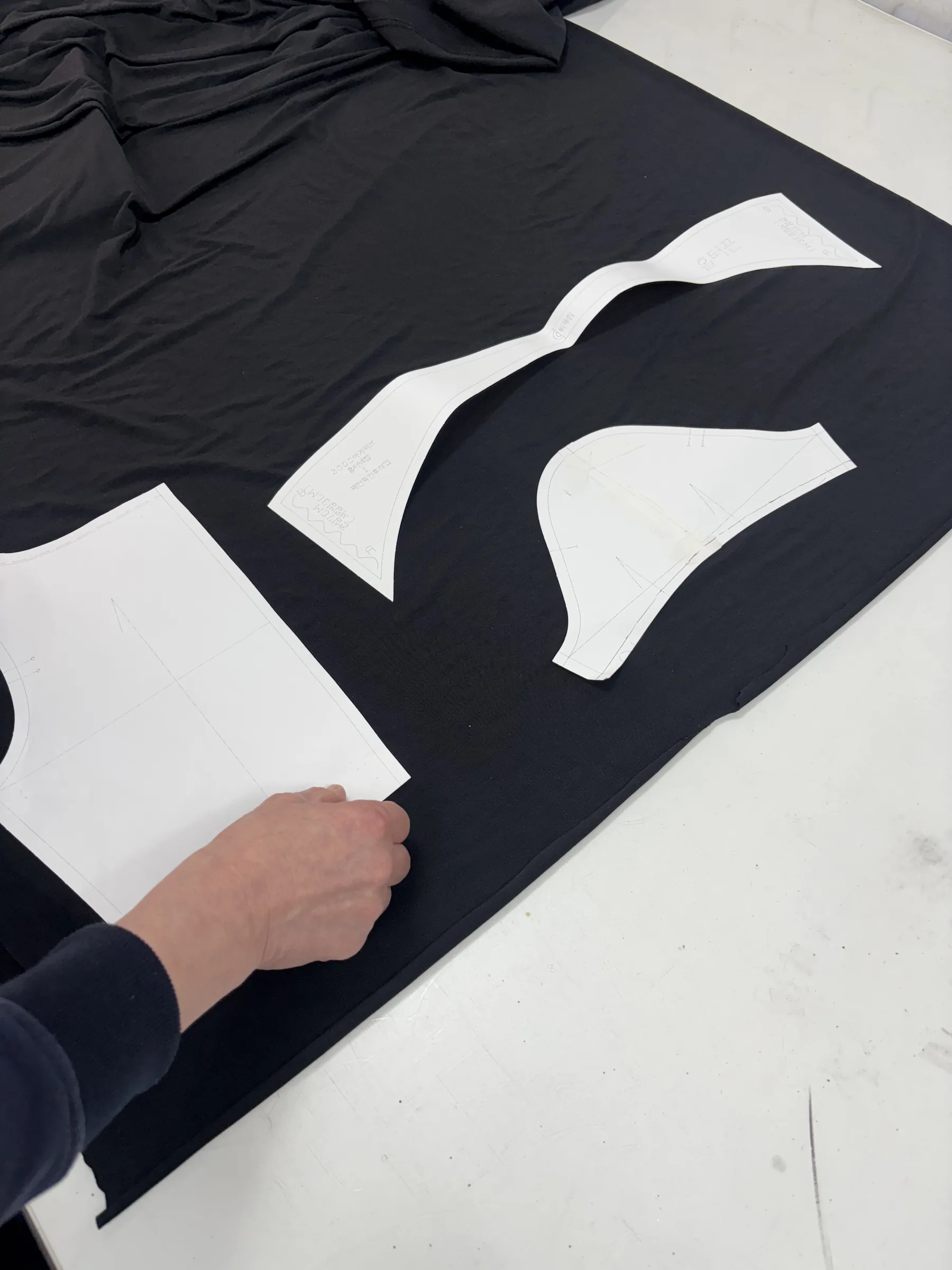 Cutting jersey against a paper template